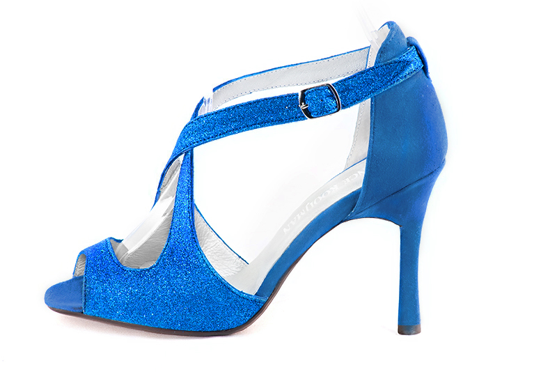 Electric blue women's closed back sandals, with crossed straps. Round toe. Very high slim heel. Profile view - Florence KOOIJMAN